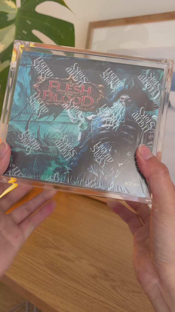 Flesh and Blood booster box acrylic case, held in hand – ACRYLIX