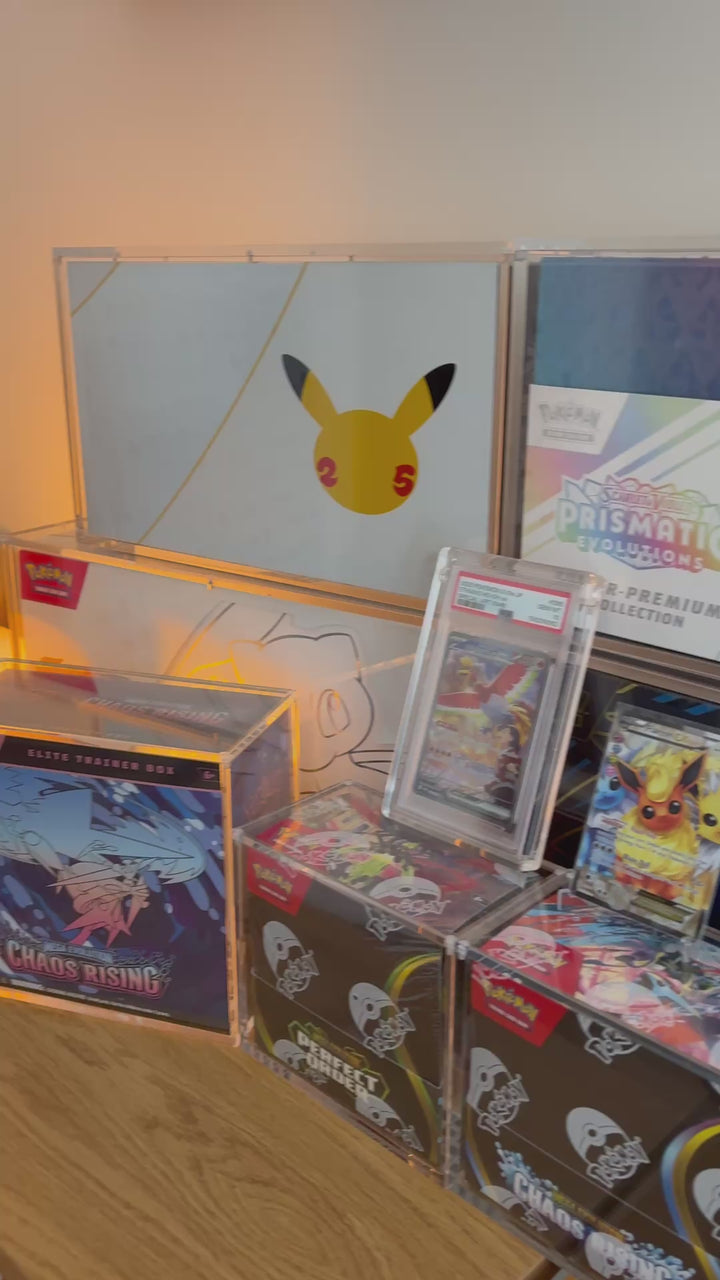 Display of sealed Pokémon collectables and graded cards in acrylic cases – ACRYLIX