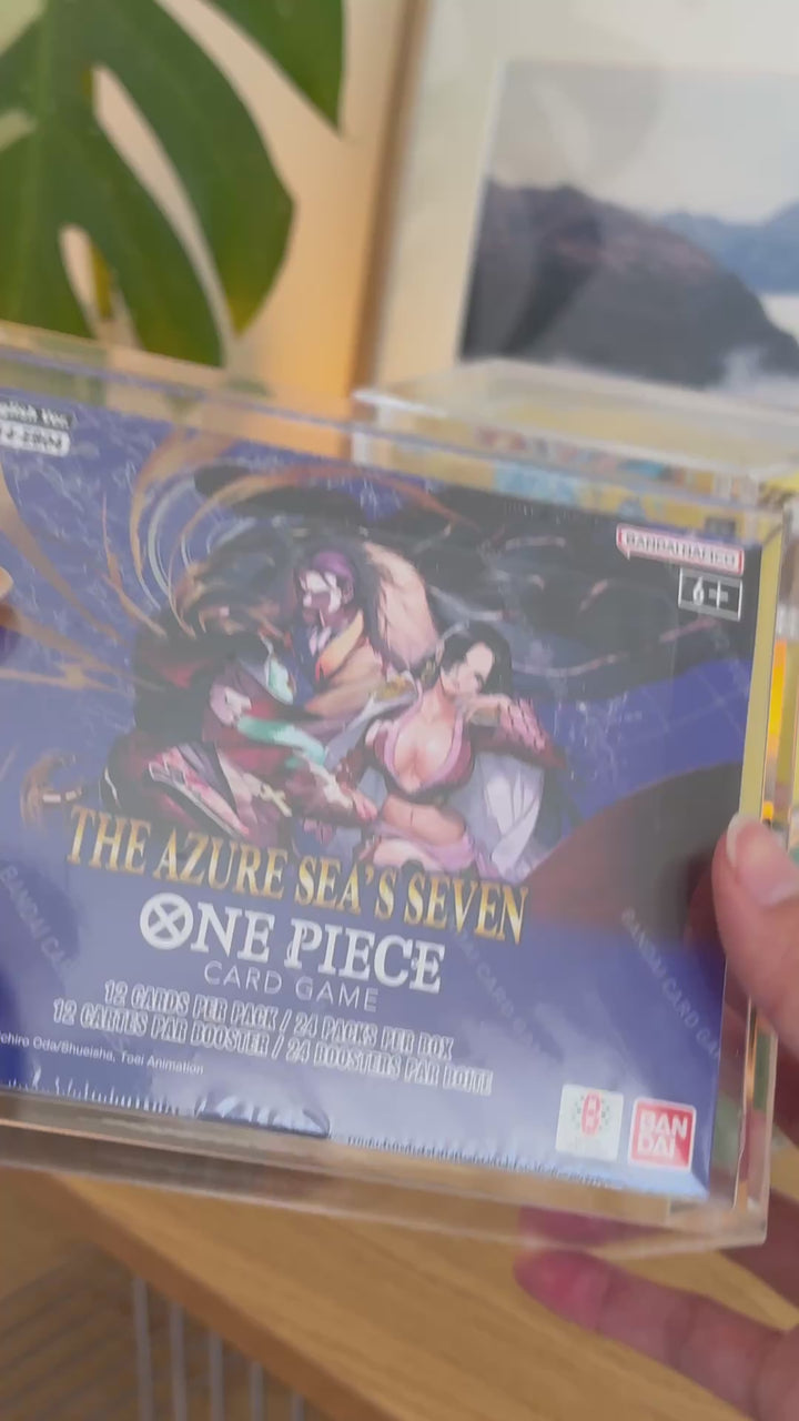 One Piece booster box acrylic case holding The Azure Sea's Seven, held in hand – ACRYLIX