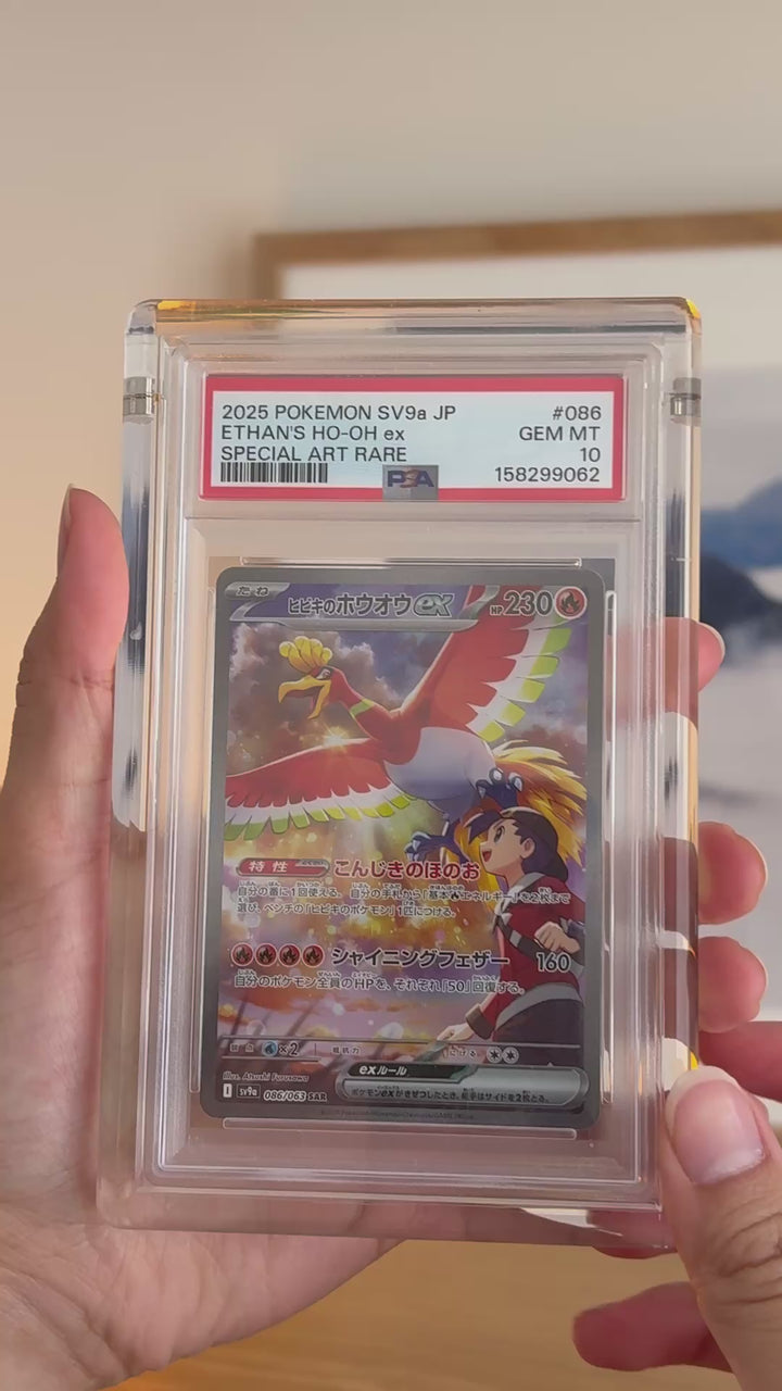 PSA graded card acrylic case holding a PSA-graded Ho-Oh ex, held in hand – ACRYLIX