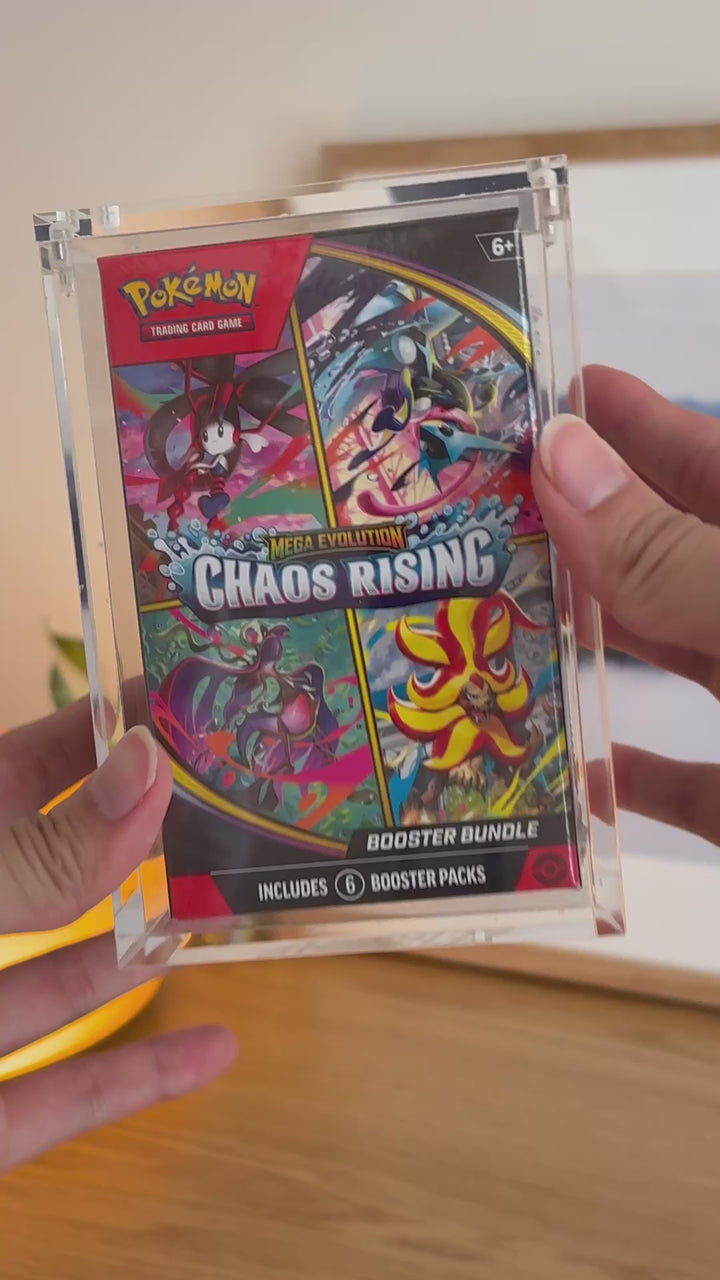 Pokémon booster bundle acrylic case (2026 onwards) holding Chaos Rising, held in hand – ACRYLIX