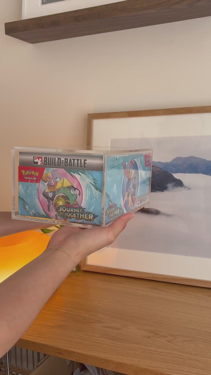 Pokémon Build & Battle 10-pack box acrylic case holding Journey Together, held in hand – ACRYLIX